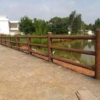 郑州天艺厂家直销新乡地区批发仿树皮栏杆配合水景水泥产品